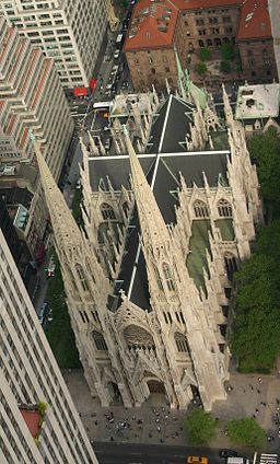 An aereal view of church roof ridge showing a very blatant Latin cross defining its architecture.