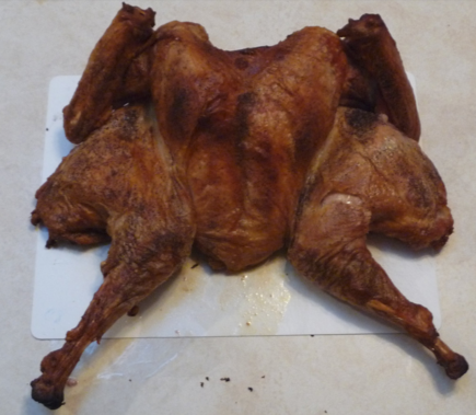 Photograph of spatchcocked turkey, showing crisp crust.